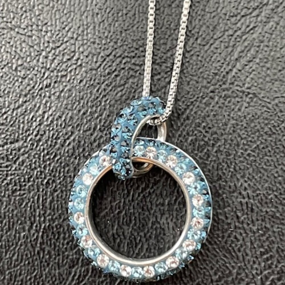Vintage Sterling silver necklace with teal & white rhinestone round pendant